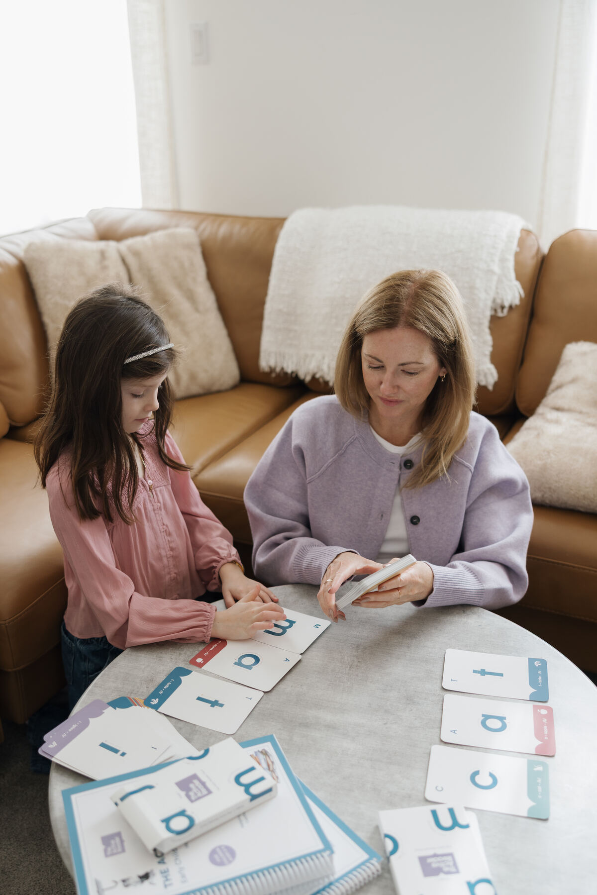 Parent and child using Active Reader alphabet cards together