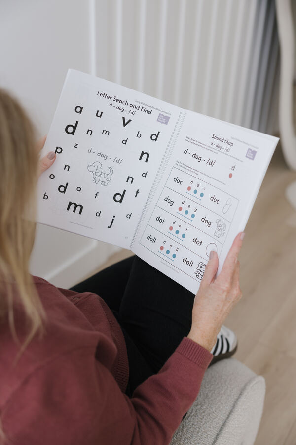 Parent reading through the Active Reader learner manual